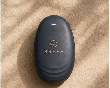 BREVA resting on a soft sand-colored surface